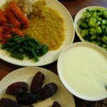 Vegetarian Indian meal with Dal, rice,green beans, squash, cucumber,yogurt, and dates