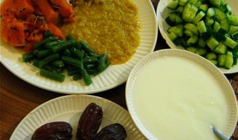 Vegetarian Indian meal with Dal, rice,green beans, squash, cucumber,yogurt, and dates