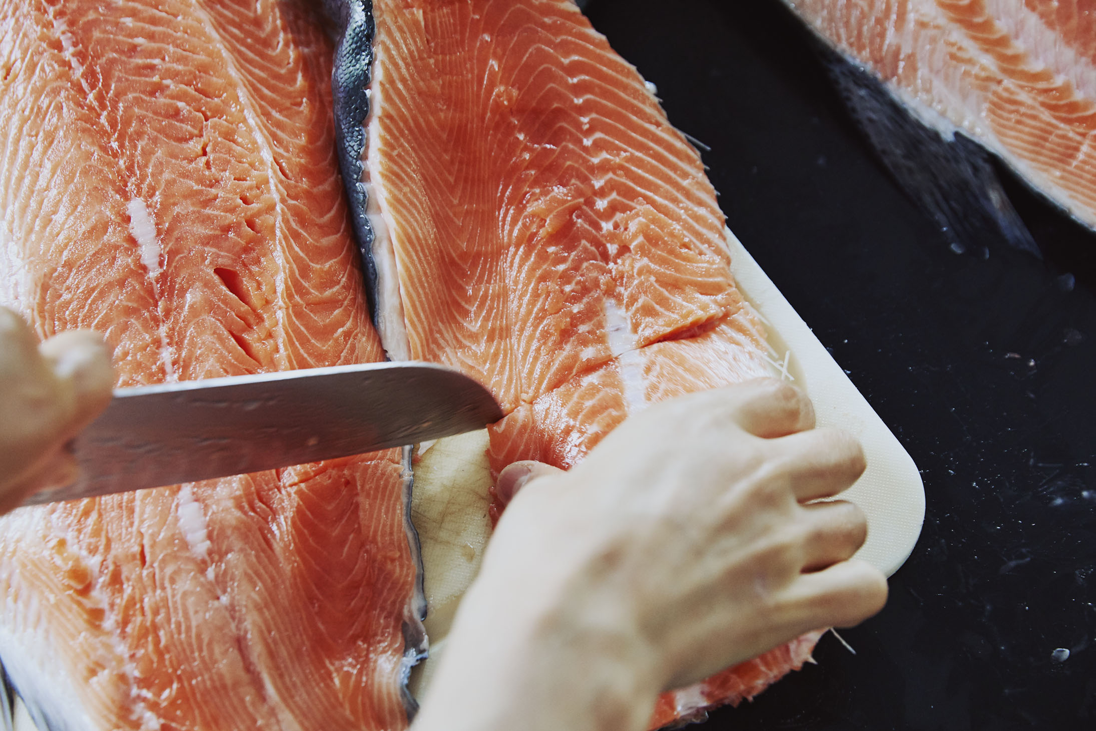 Salmon filleting a whole fish sustainable