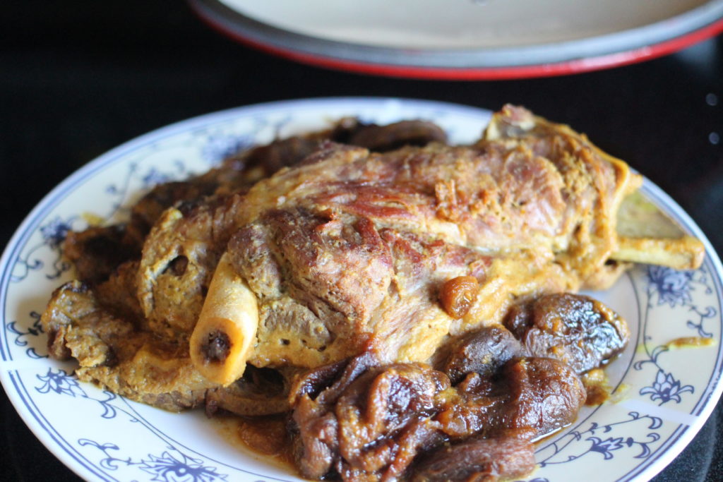 braised lamb shoulder bone-in with dried apricots and spices