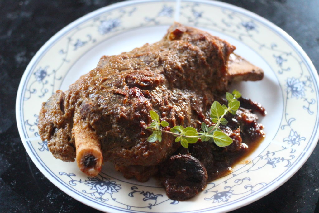 braised lamb shoulder bone-in with dried apricots and spices