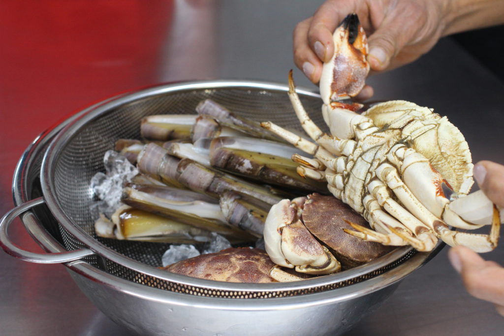 cleaning crab and razor clams