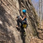 Amie Watson bolting rock climbing route in Lanaudiere Quebec